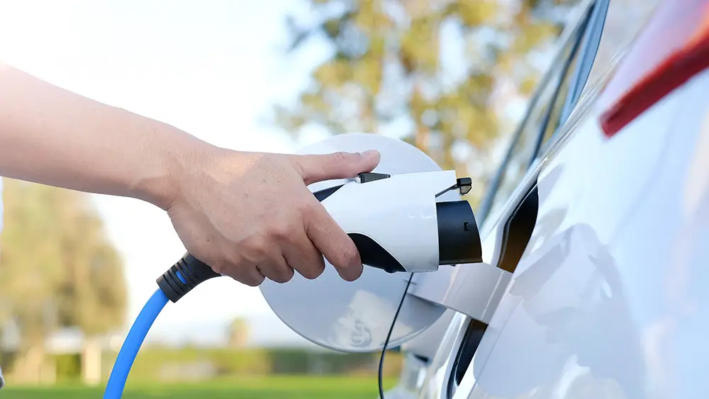 Licensed electrician installing a Level 2 EV charger in a Federal Way, WA garage
